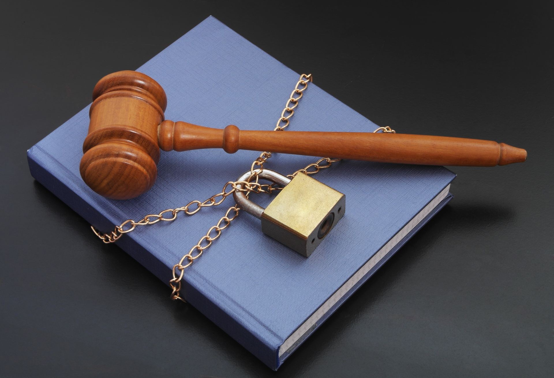 Information security concept, banned book, gavel, book with chain and padlock